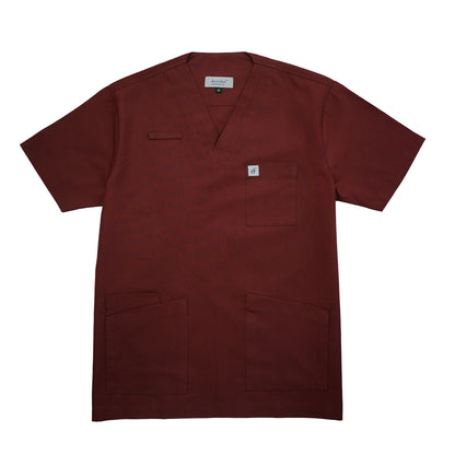 Maroon scrub top with a small logo on a white background