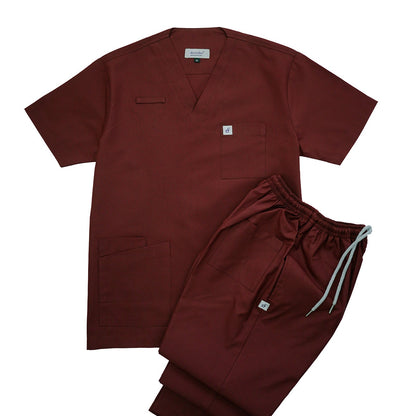 Maroon scrub set with shirt and pants on a white background